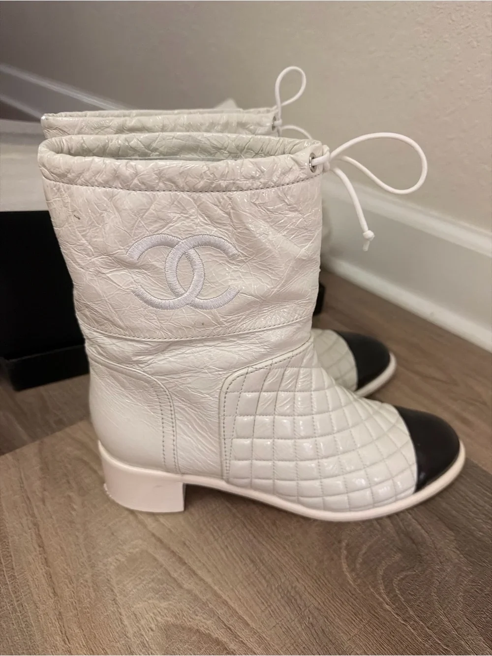 CHANEL White Quilted Leather Ankle Boots with Black Cap Toe and Drawstring